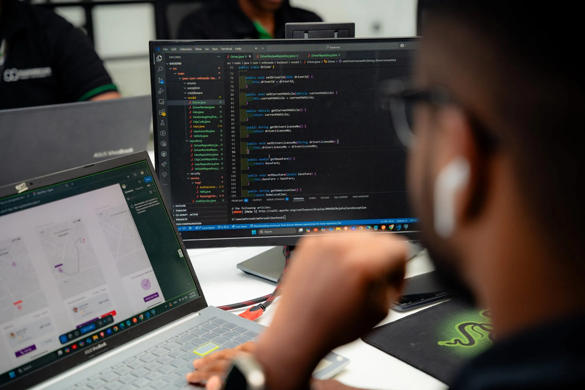 Developer coding at a workstation in the W3Inventor office