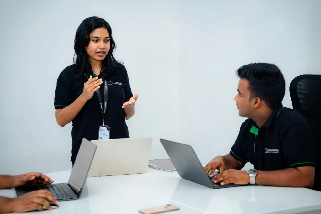 W3Inventor marketing strategist presenting a digital campaign plan to a teammate in the Pannipitiya - Colombo office