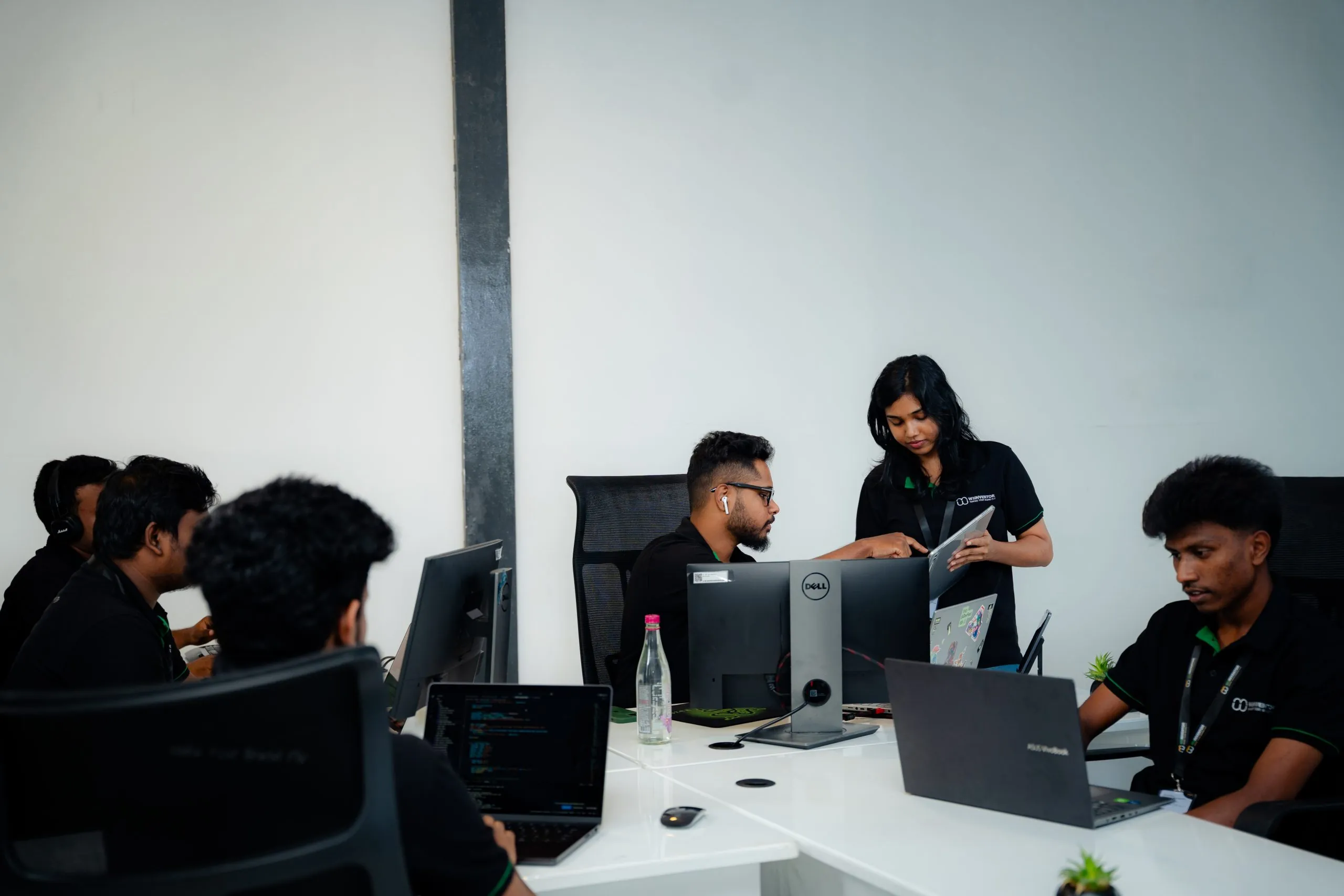 UI/UX design – W3Inventor team members at their desks