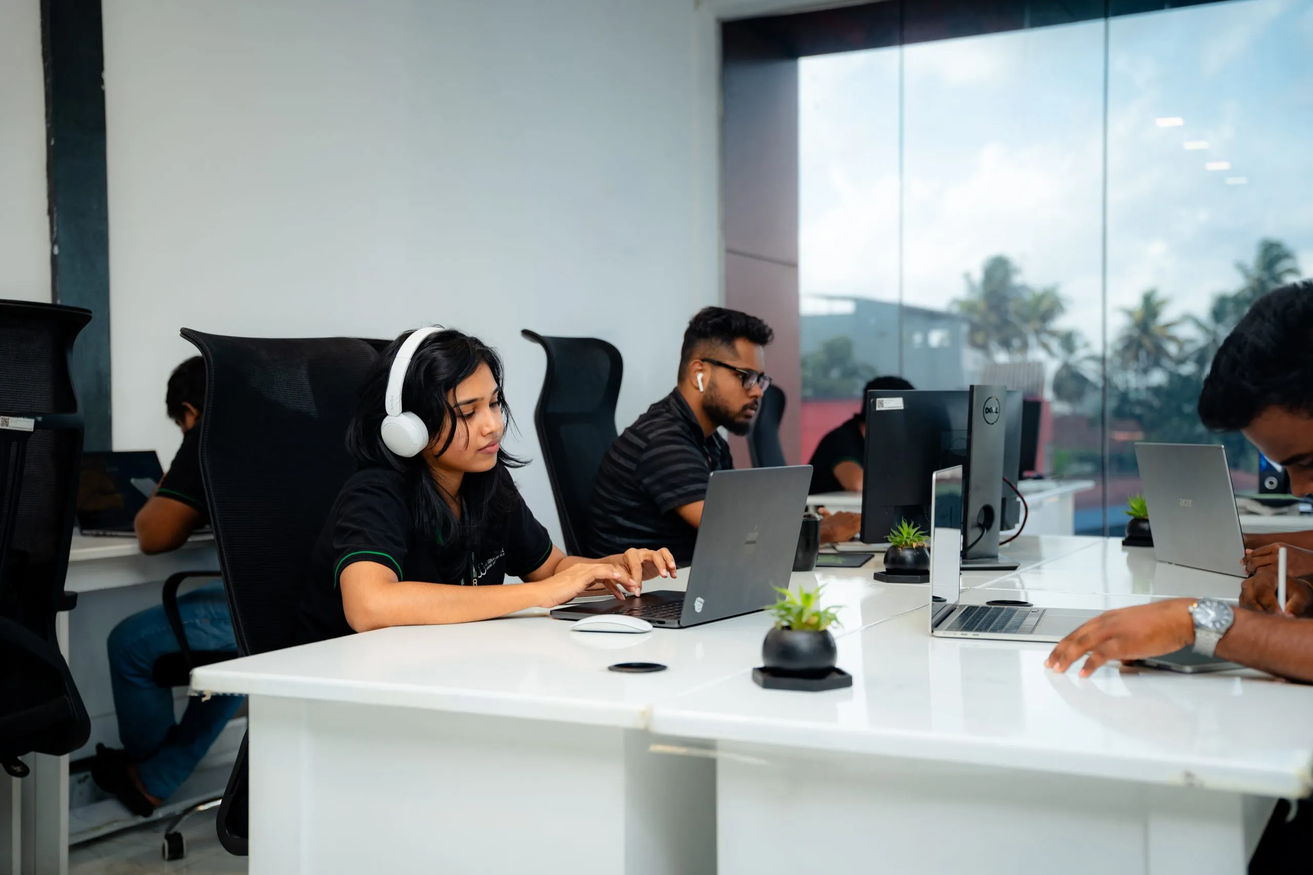 email marketing – W3Inventor team working in an office with large windows